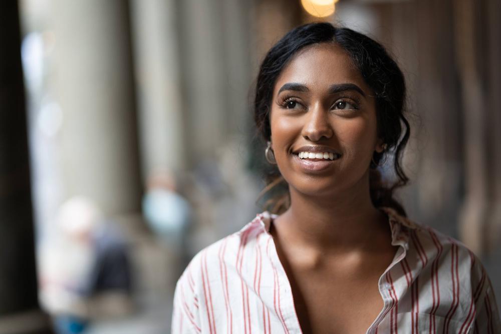 woman smiling after dental extraction