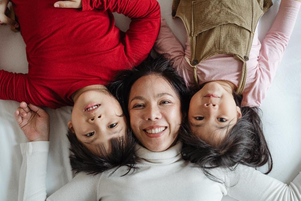 family of 3 smiling