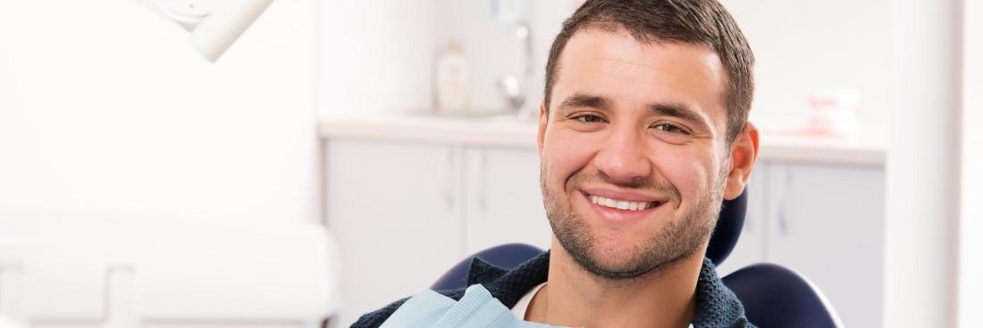Man smiling during check up at Colorado Springs Family Dental