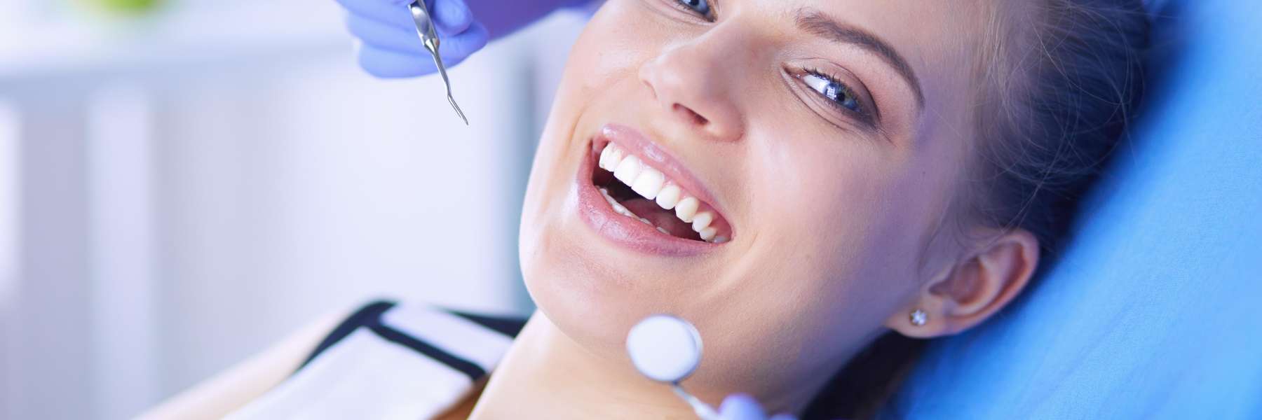 Lady smiling during teeth whitening in Colorado Springs