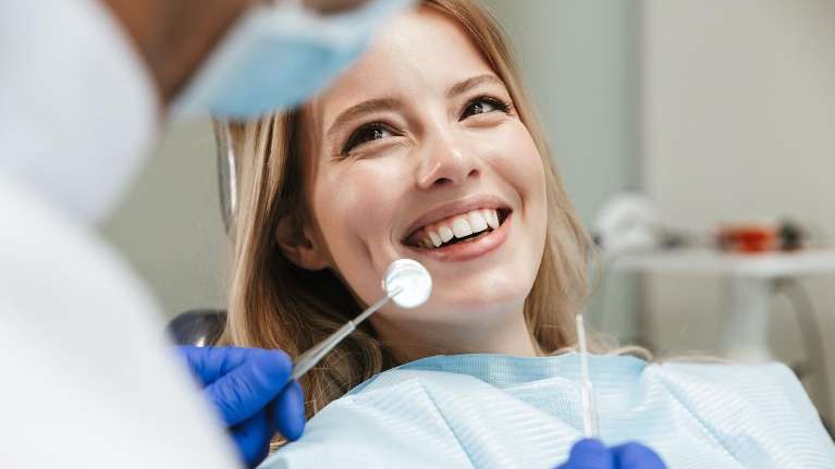 A lady undergoing dental examination in Colorado Springs, CO