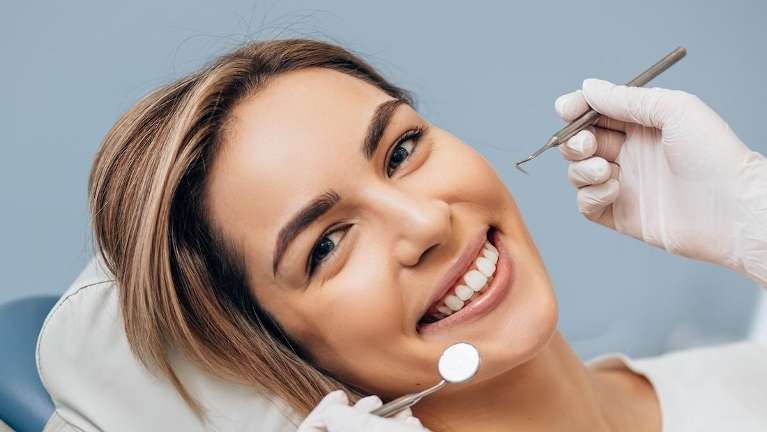 A lady undergoing cosmetic bonding in Colorado Springs, CO