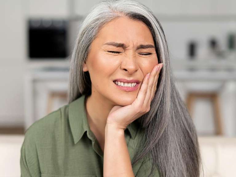 An Elderly woman with Emergency Dentistry in Colorado Springs