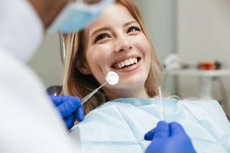 A woman smiling after getting Dental Implants in Colorado Springs, CO