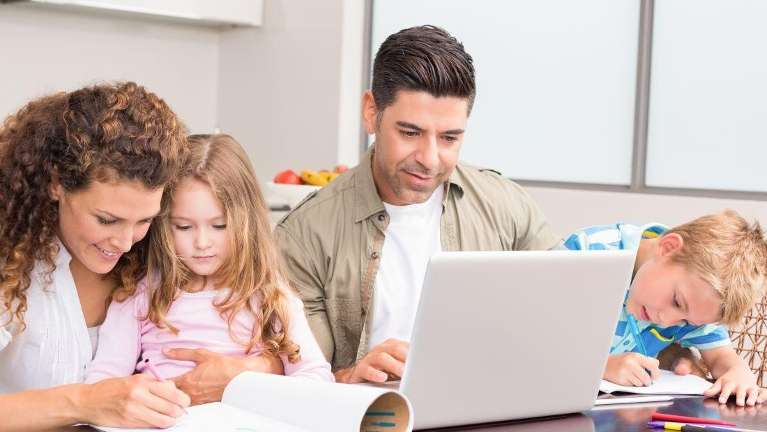 Family reading about the best dentist in Colorado springs