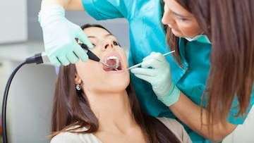 Lady undergoing dental examination at Springs Family Dental
