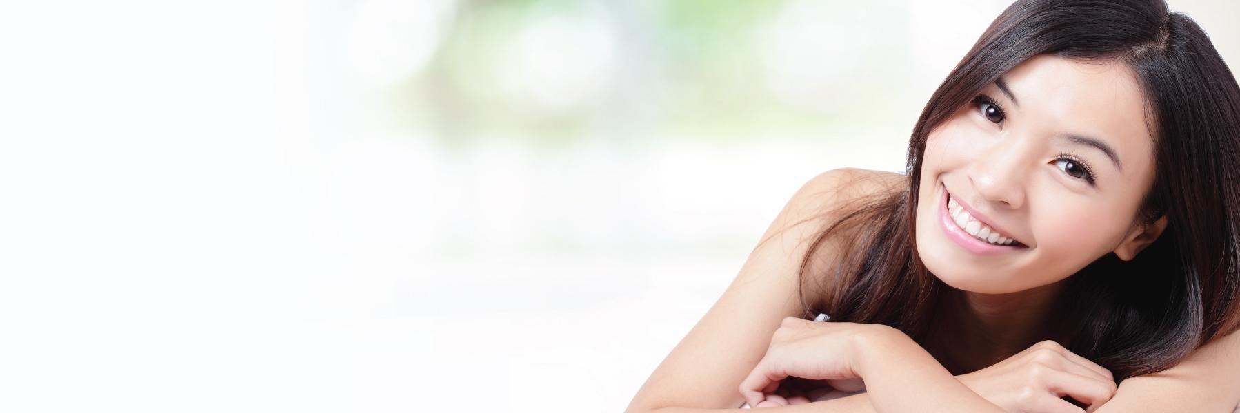 woman smiling after getting veneers in Colorado Springs